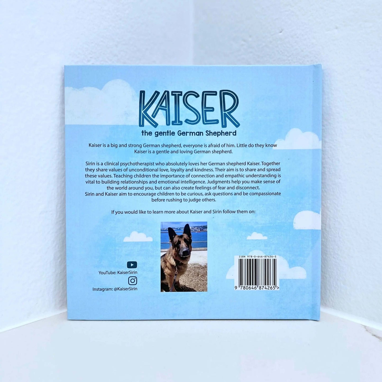 Back cover of 'Kaiser the Gentle German Shepherd' book featuring illustrations and a description of Kaiser and Sirin.